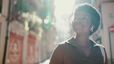 African-girl-walking-down-the-street-looking-happy