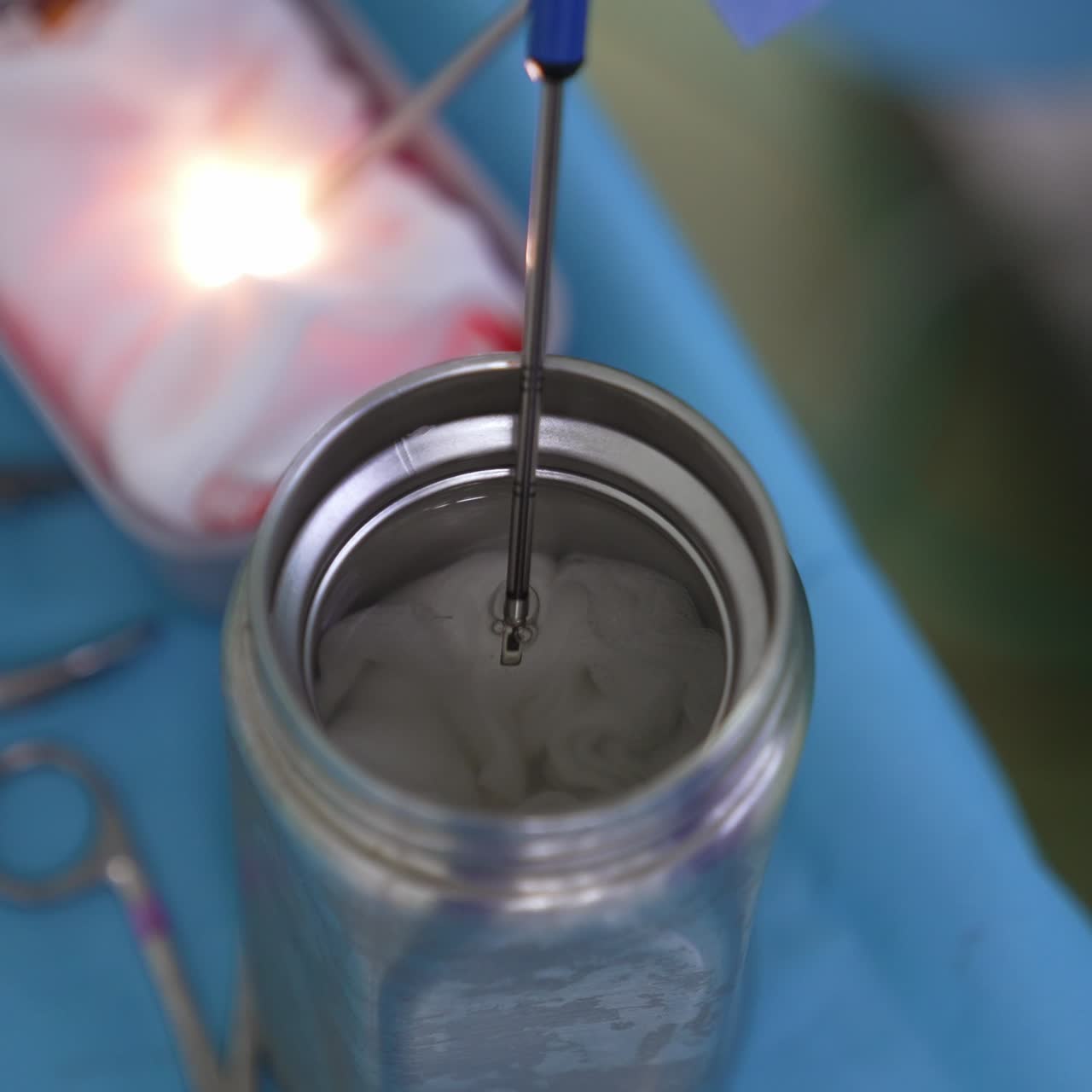 Technological device for conducting modern surgeries. The instrument is placed into liquid for cooling. Close up