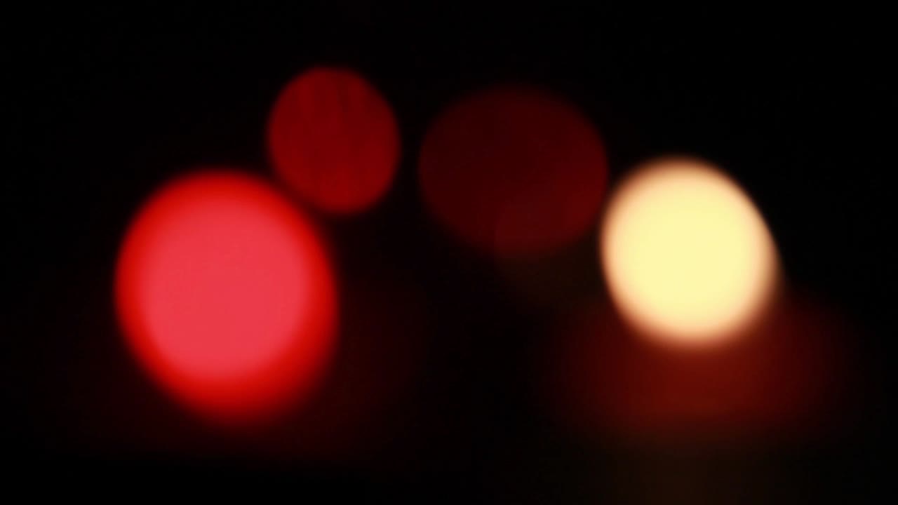 Abstract Red and Yellow Bokeh Lights on Dark Background