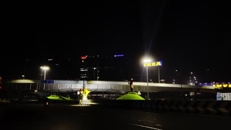 a static shot of a highway with cars at night