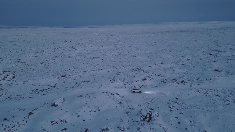 view at parked jeep and man checking terrain, impassable, dangerous highland road