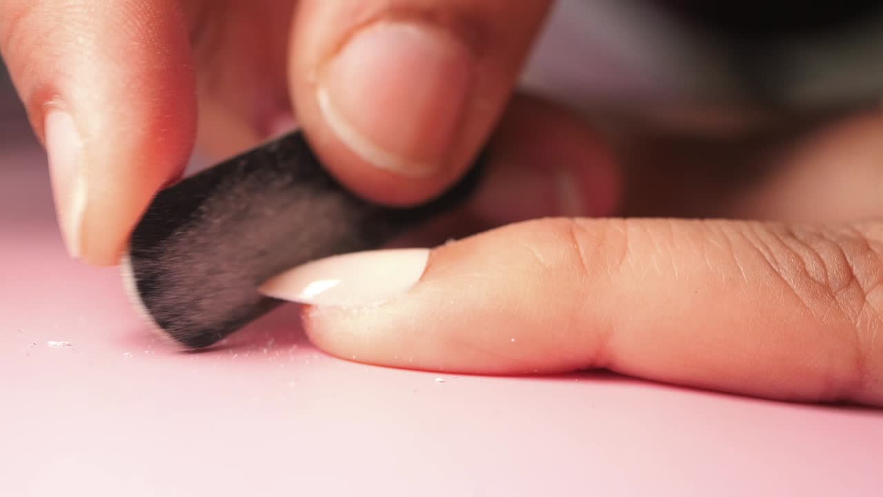 Woman getting her nails filed