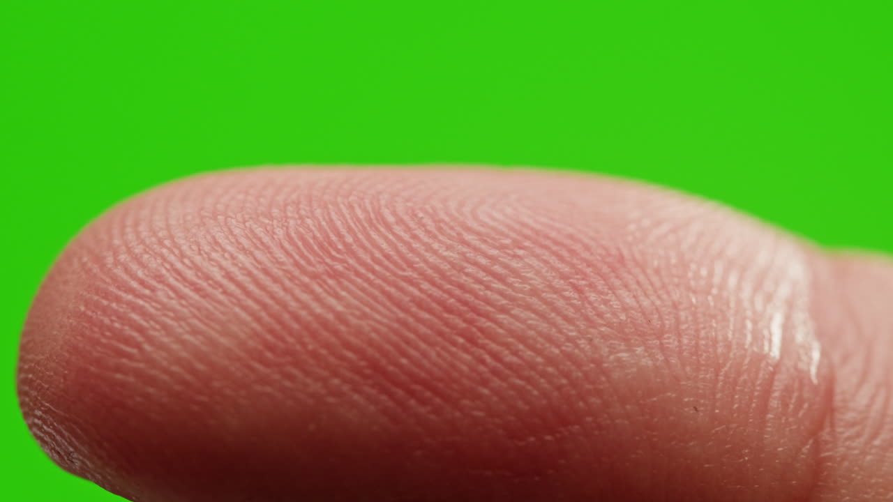 Close-up of a Fingerprint on a Green Screen