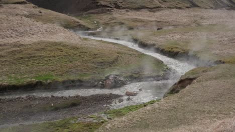 steaming water of reykjadalur hot springs, iceland