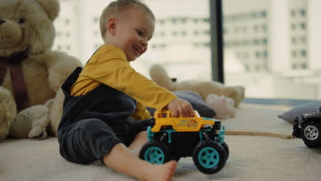 Toddler-boy-playing-toy-cars-with-unknown-relative.-Child-having-fun-indoors.