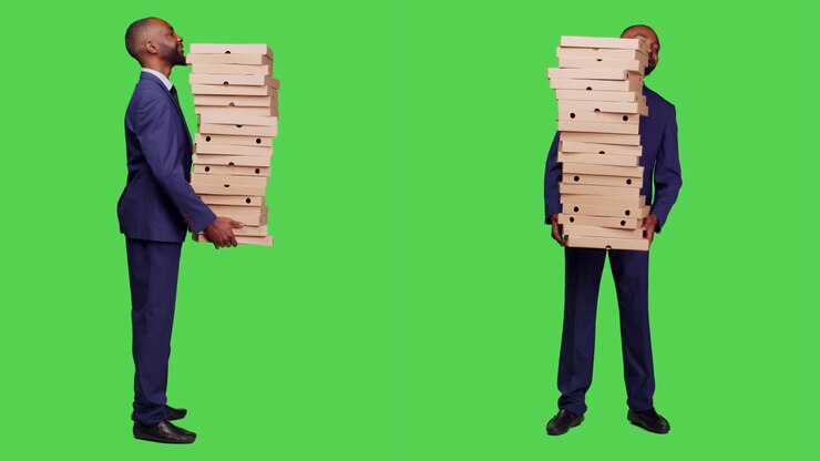 Men Carrying Stacks of Pizza Boxes