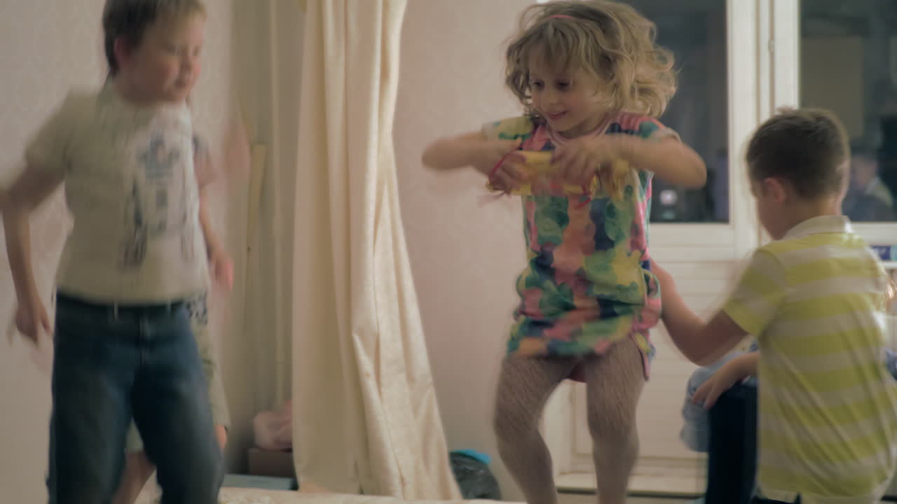 Boys and girls excitedly jumping around