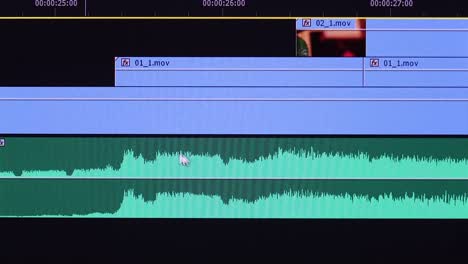 video editing software interface with timeline and waveform display