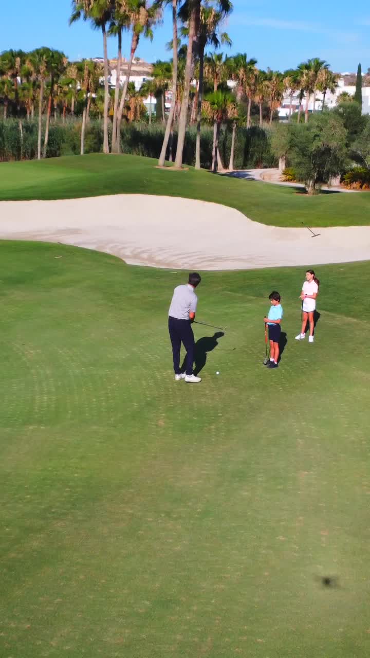 Family golfing on a sunny day