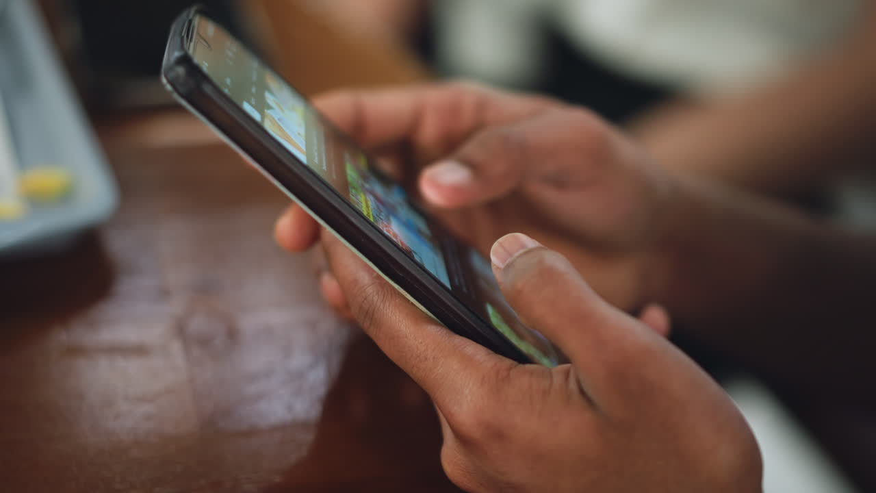Close up view of person finger pressing phone screen showing focus on dark mark on thumbnail, subtle skin texture, interaction with touch device, intimate detail shot conveying everyday realism