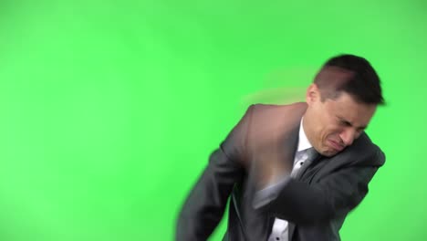 man in elegant suit pinching nose in studio