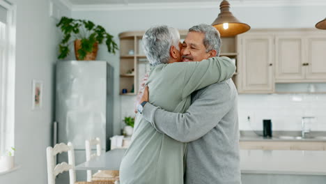 Senior-couple,-hug-and-kiss-in-home-for-love