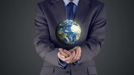 businessman presenting earth with hands