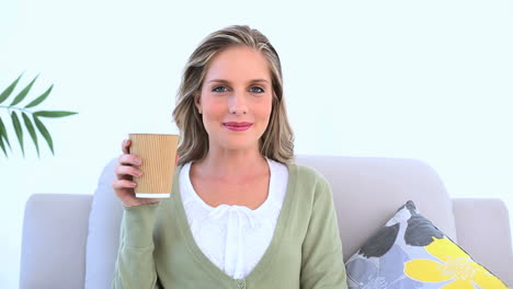 Cheerful-woman-drinking-coffee