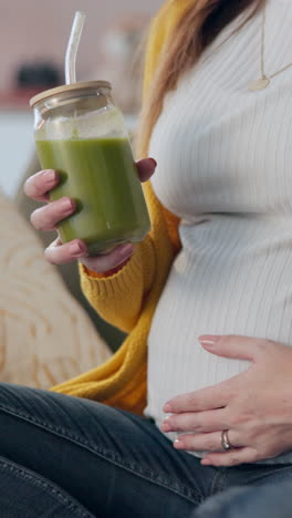 pregnant woman enjoying a green smoothie