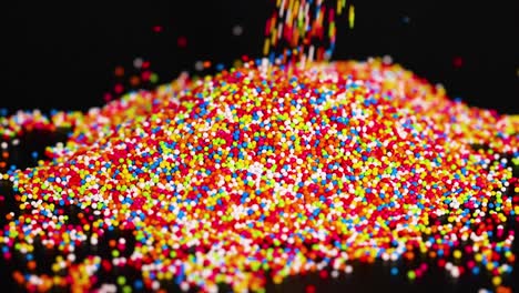 vibrant sprinkles cascading onto a growing mound