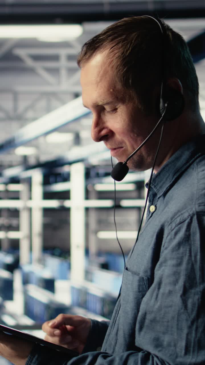 Vertical Video Data Center Admin Talking In Audio Headset Mic, Helping Clients