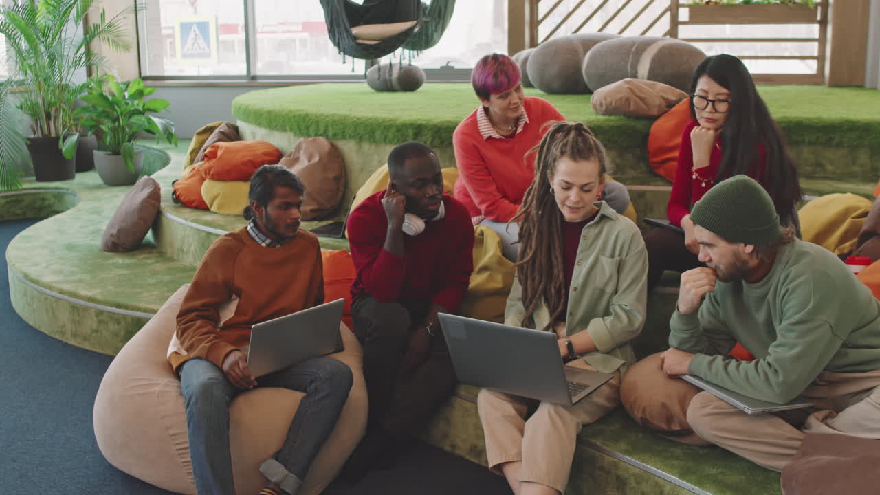 Team of Young Start-Up Workers Discussing Project