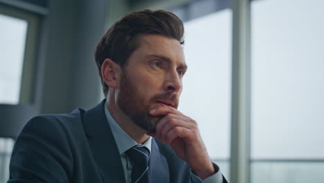 focused businessman working laptop at panoramic office closeup. ceo thinking