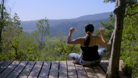 young woman meditation in the forest, sport outdoors