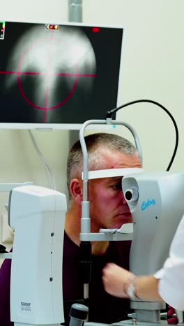 optometrist optician doctor examines patient