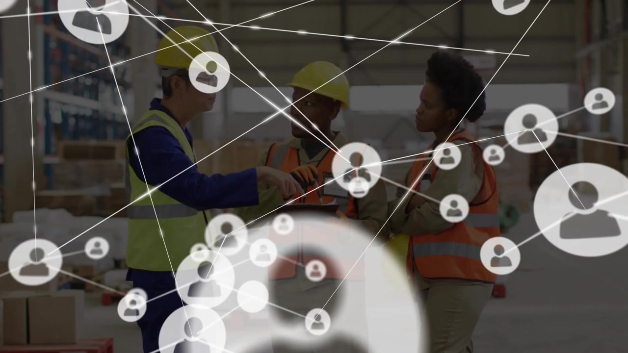 Warehouse staff pointing at tablet and forming network overlay showing supply-chain connectivity