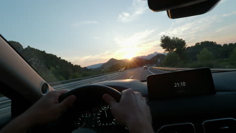 driving at sunset with dashboard clock display