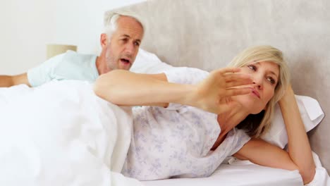 Couple-having-an-argument-in-bed