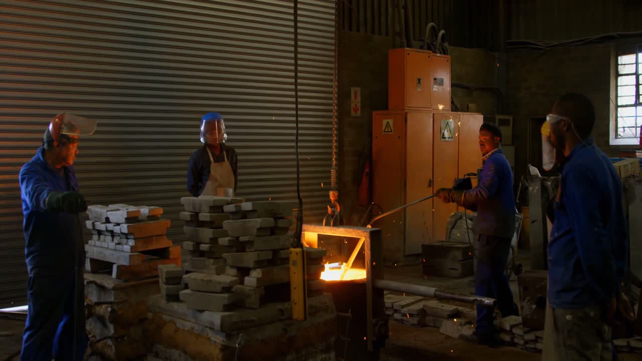 Workers working in foundry workshop 4k