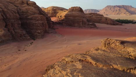 wadi rum, valley of the moon in jordan, aerial forward dolly at sunset