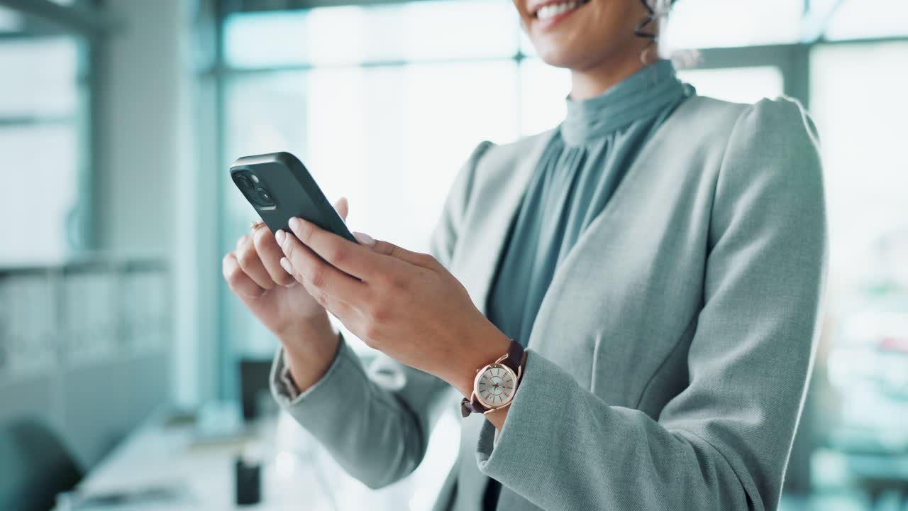 Professional businesswoman using smartphone in modern office