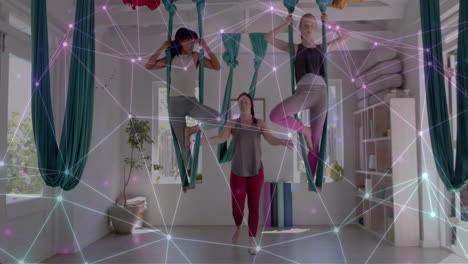 Animation-Eines-Netzwerks-über-Verschiedene-Lehrerinnen-Und-Teenager-Mädchen,-Die-Aerial-Yoga-Praktizieren