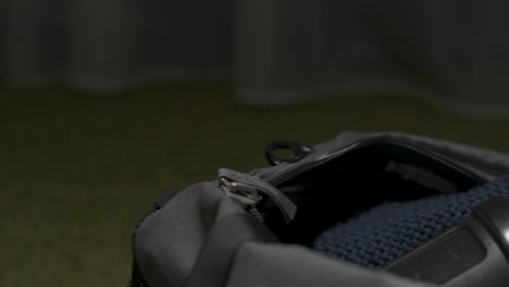 boxing gloves and bag in a dark room