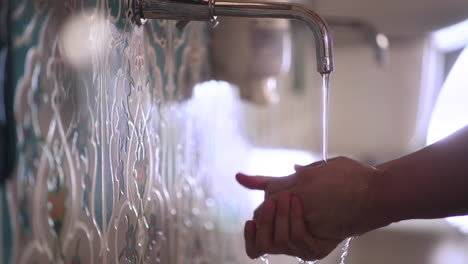 Muslim-man-washing-his-hands-before-entering-to-mosque