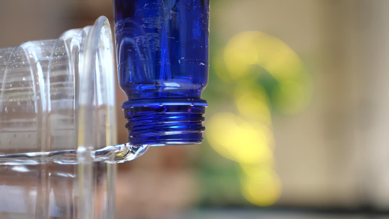 Blue Plastic Bottle in a Clear Container