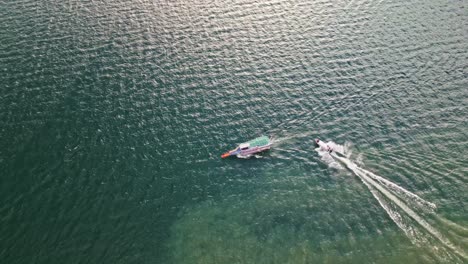 Aerial-view-of-boats-navigating-in-Lake-Atitlan-near-Panajachel-in-Guatemala