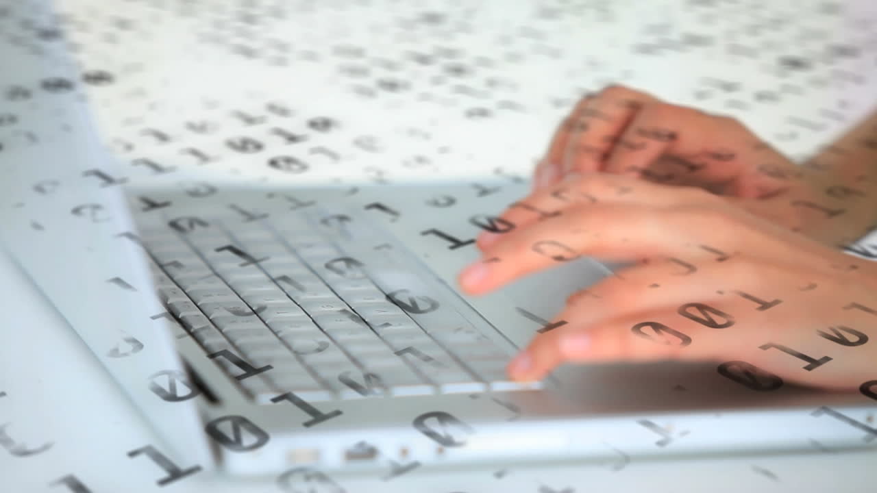 Animation of changing numbers over a person using a laptop writing on keyboard