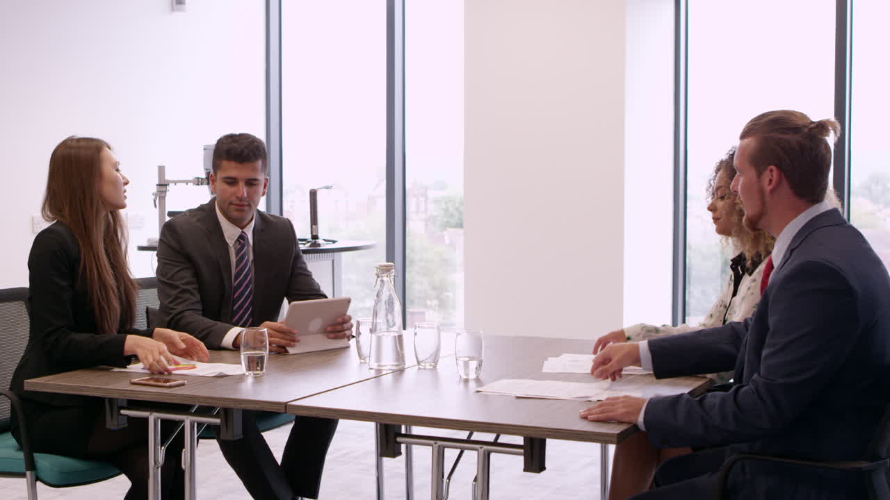 Businesspeople Work Together At Desk In Office Shot On R3D