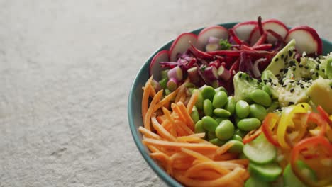 Composition-of-bowl-of-rice-and-vegetables-with-chopsticks-on-white-background