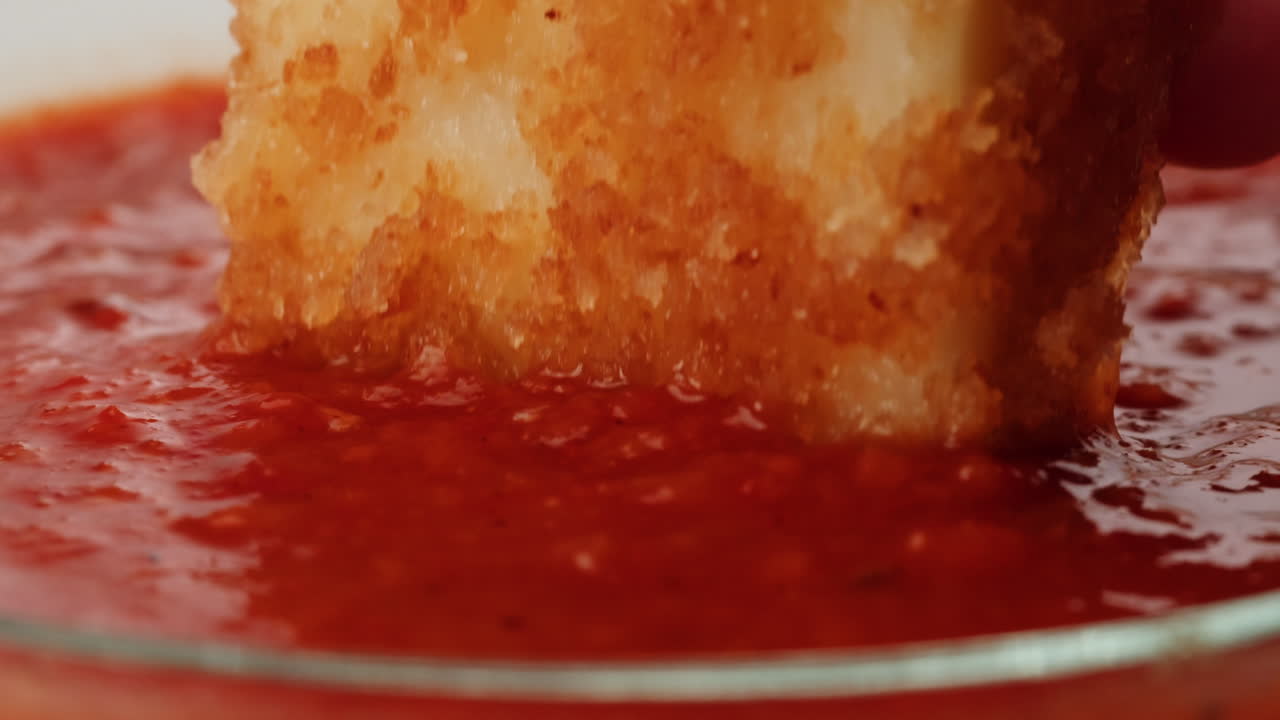 Crispy Fried Cheese Bites Dipped in Tomato Sauce