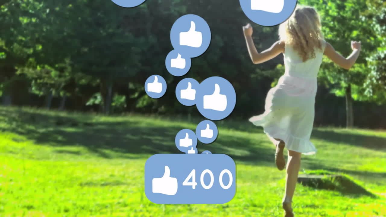 woman skipping across sunlit park lawn, featuring floating blue like icons marketing data overlay
