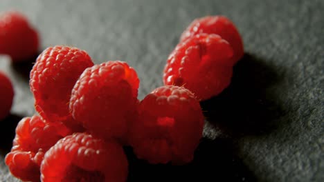 Raspberries on black background 4K 4k