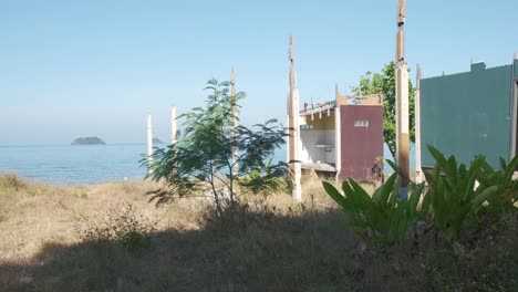 static shot of a derelict beach bungalow in thailand due to travel restrictions and boarder closures during the pandemic