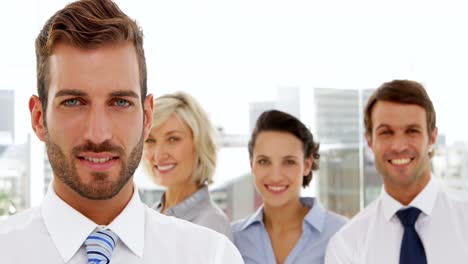 cheerful business team smiling at the camera