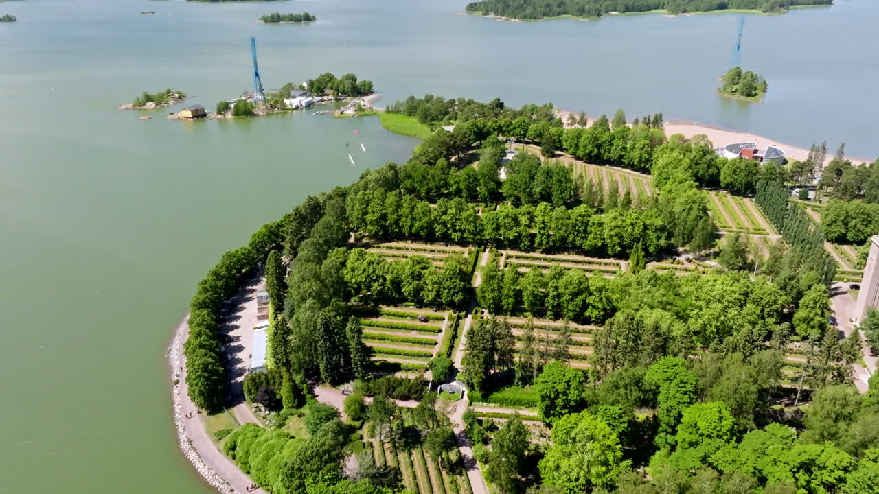 Aerial view flying over the Hietaniemi cemetery, sunny, summer day in Helsinki