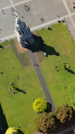 descending social ratio aerial video of the grounds of trinity college dublin in dublin city centre, ireland on a bright and sunny day. filmed in 1080x1920 and with rec709 color
