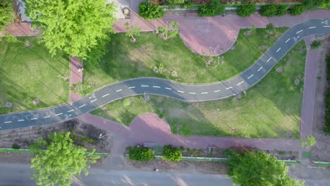 Aerial-Above-Shot-of-Bikes-Path-at-Netivot-City,-Israel