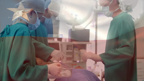 animation of flag of chile over caucasian surgeons during surgery