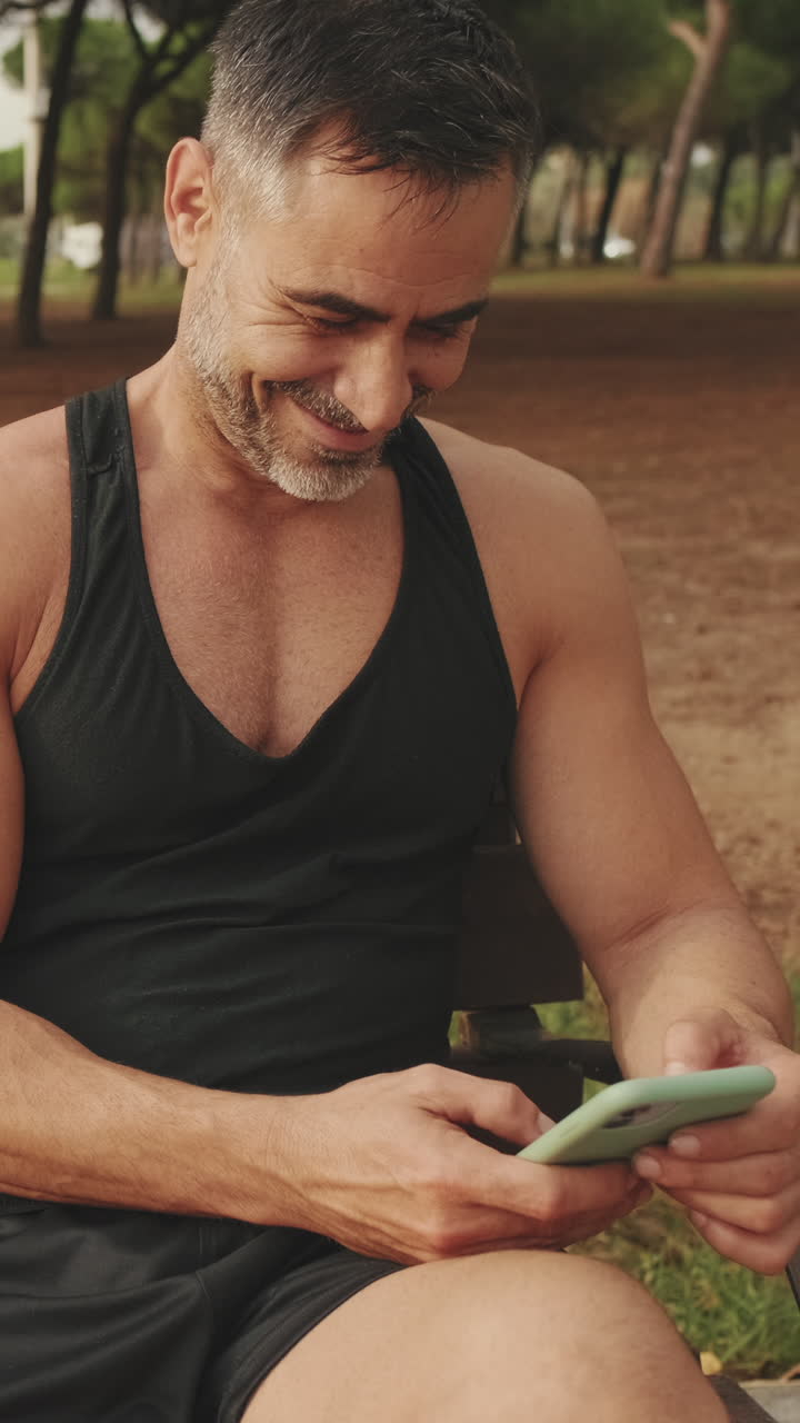 Man using smartphone in park