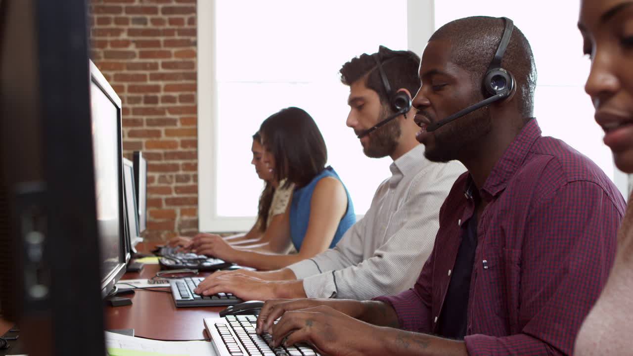 Staff At Desks In Customer Service Department Shot On R3D